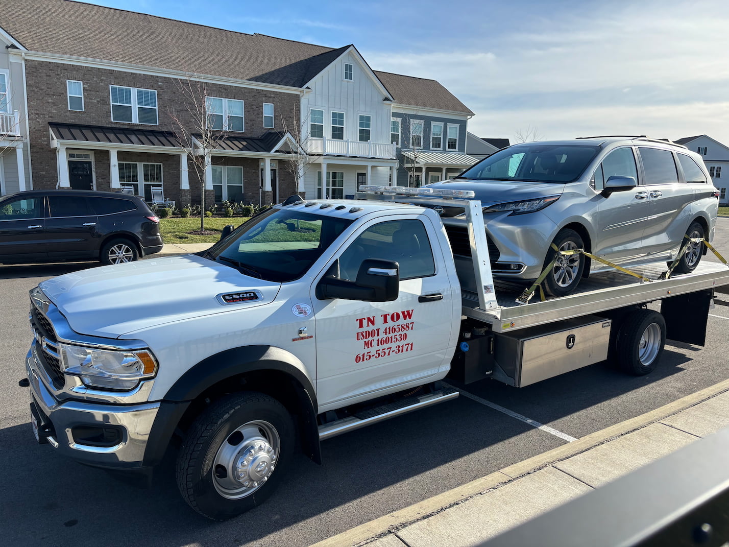 Tow Truck with Silver Toyota Sienna